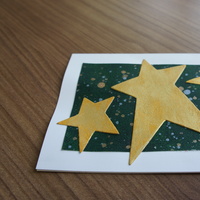 3 Stars Gold Design: five-pointed golden stars over a spacey polluck background.