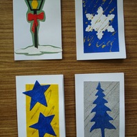 Holiday Gift Tags C: Street lantern with red box; snowflake on blue field with golden stardust; blue stars on yellow field; blue tree on silver field.