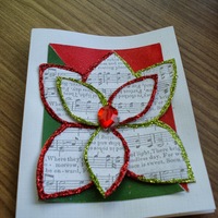 Holiday Magnolia Red & Green: Red & green glitter flower, with sheet music interior and plastic gemstone centre.