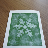 Snowflake Green: Textured snowflake on snowy green field.