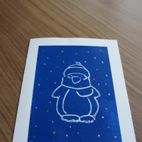 Snowman Stamp Blue: Stamped snowman on starry blue field.